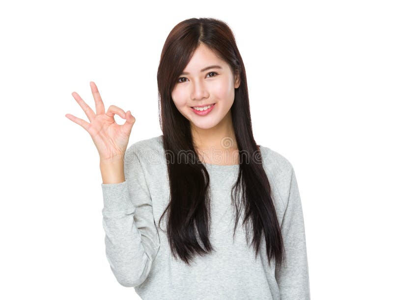 Young woman with ok gesture