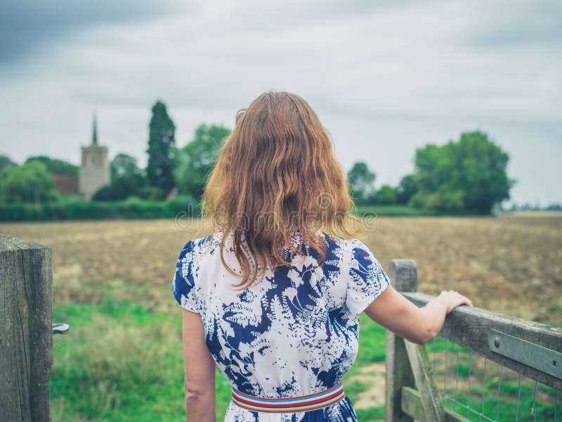 Young woman opening gate in the country stock photos Young woman opening gate in the country stock photos