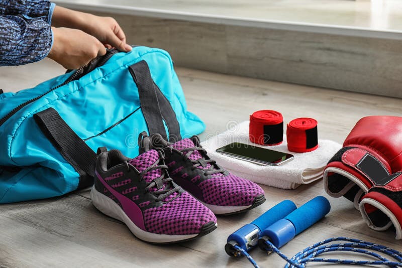 Young Woman Packing Sports Bag Stock Image - Image of handle, equipment ...