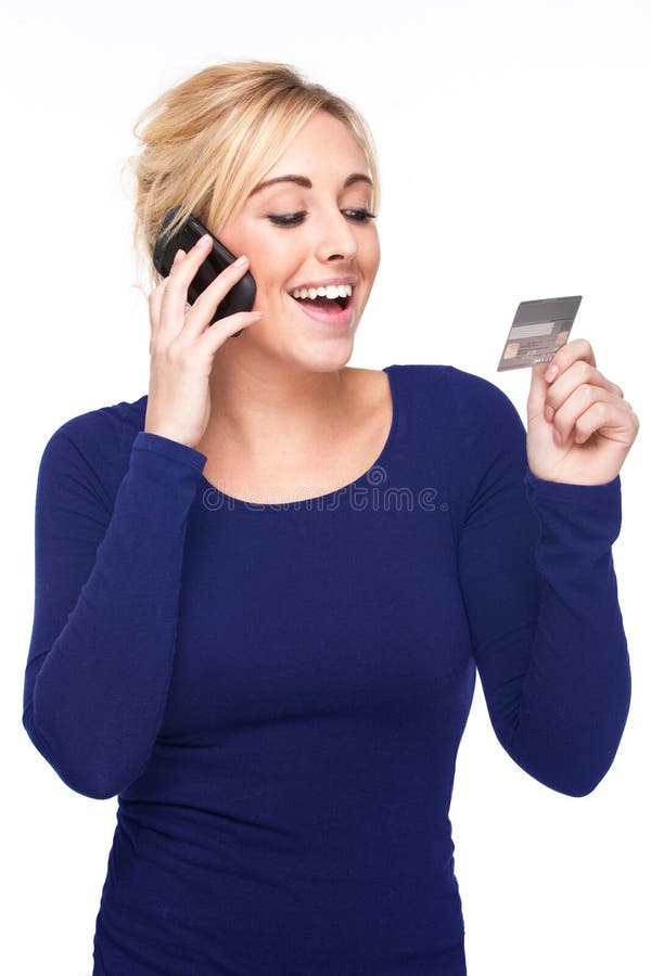 Young Woman Paying by Credit Card and Cell Phone stock images