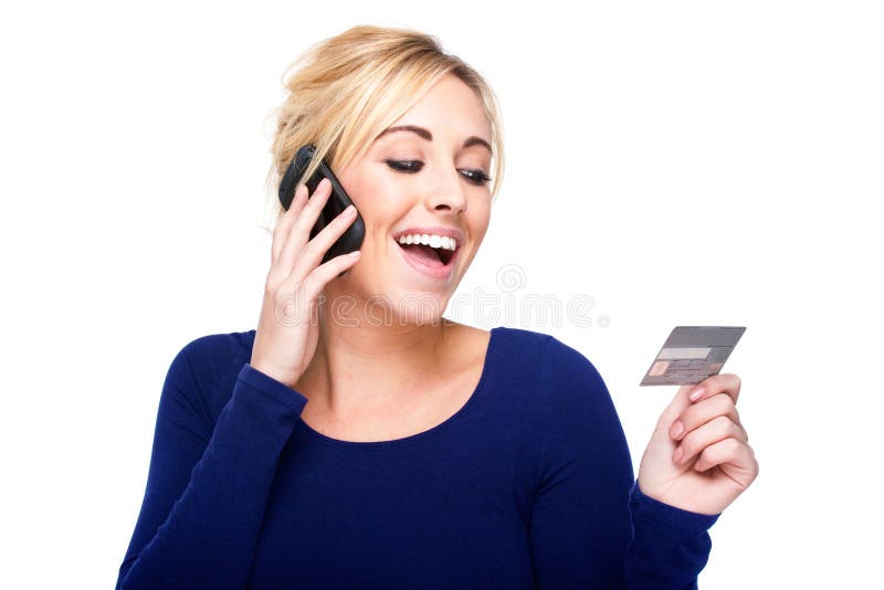 Young Woman Paying by Credit Card and Cell Phone royalty free stock photo