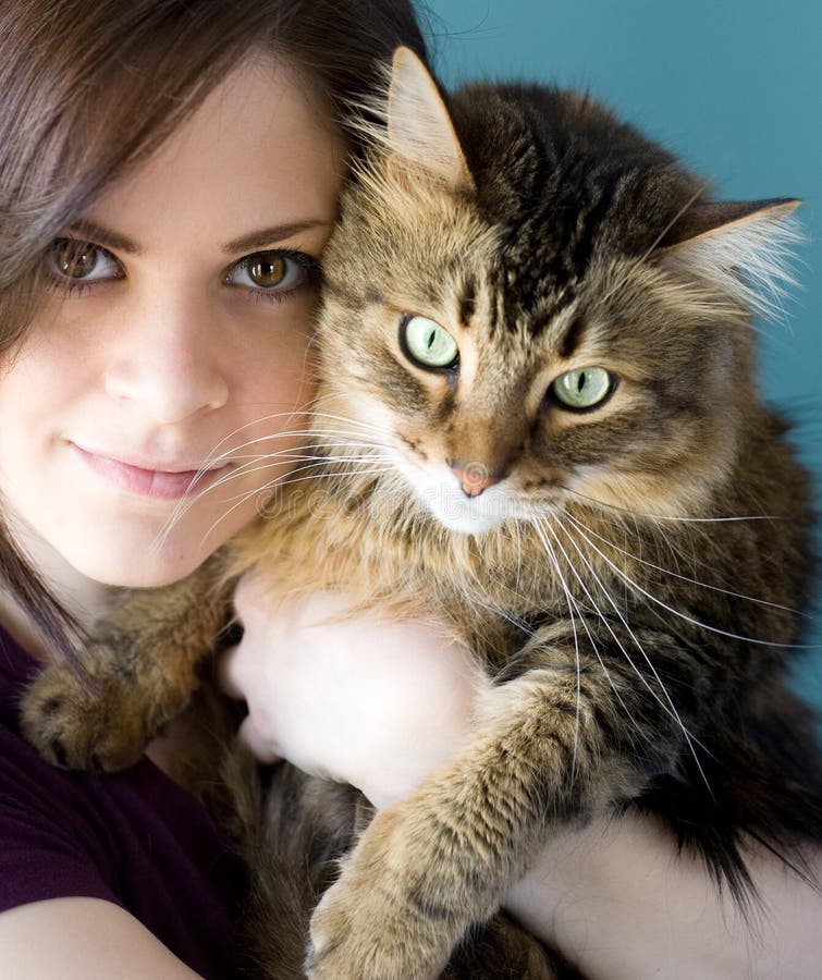 Young woman with pet cat