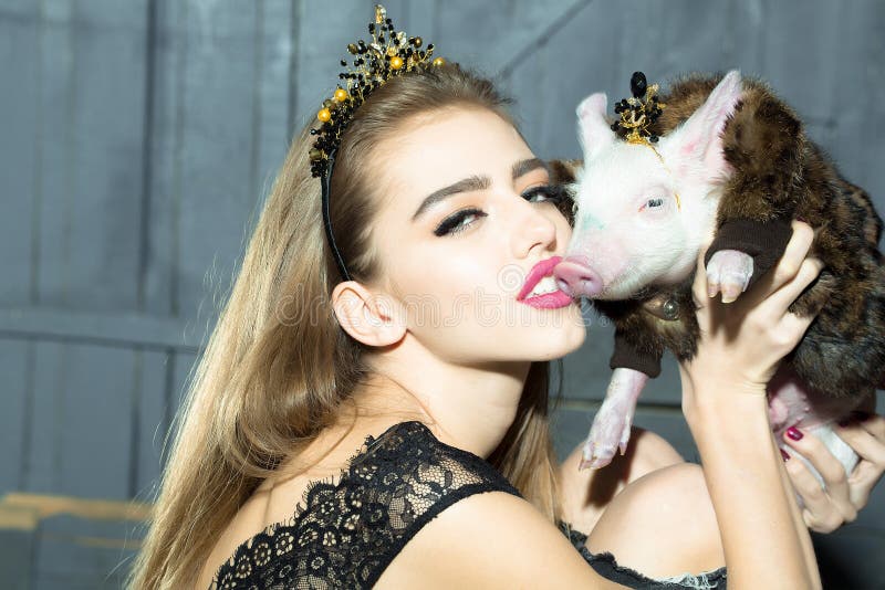 Young woman and pig stock photo
