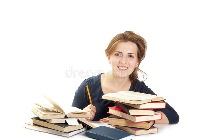 Young woman and a pile of books