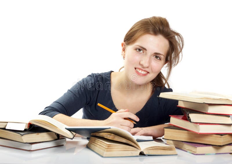 Young woman and a pile of books