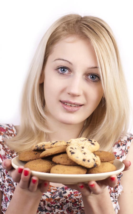 Young woman with plate of cookies