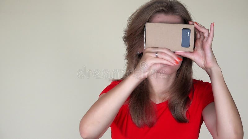 Young woman play game wearing vr glasses on face. future technology. 4K