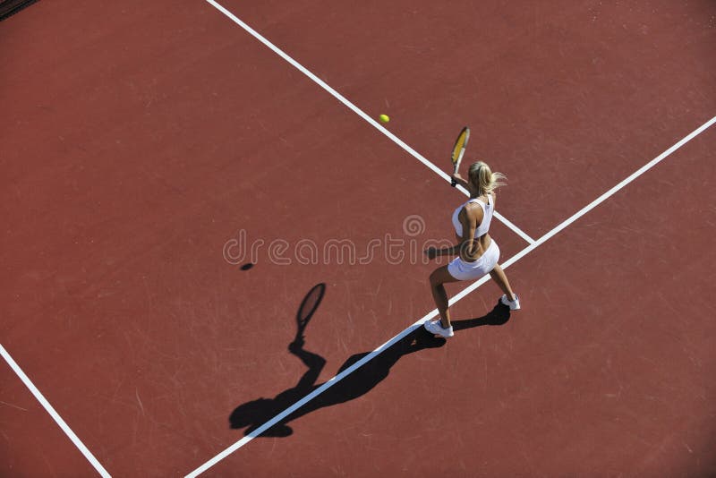 Young woman play tennis outdoor