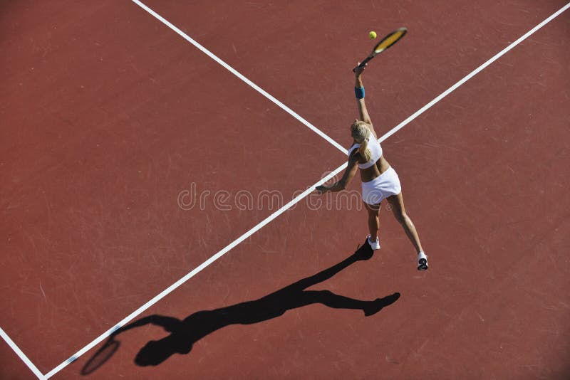 Young woman play tennis outdoor