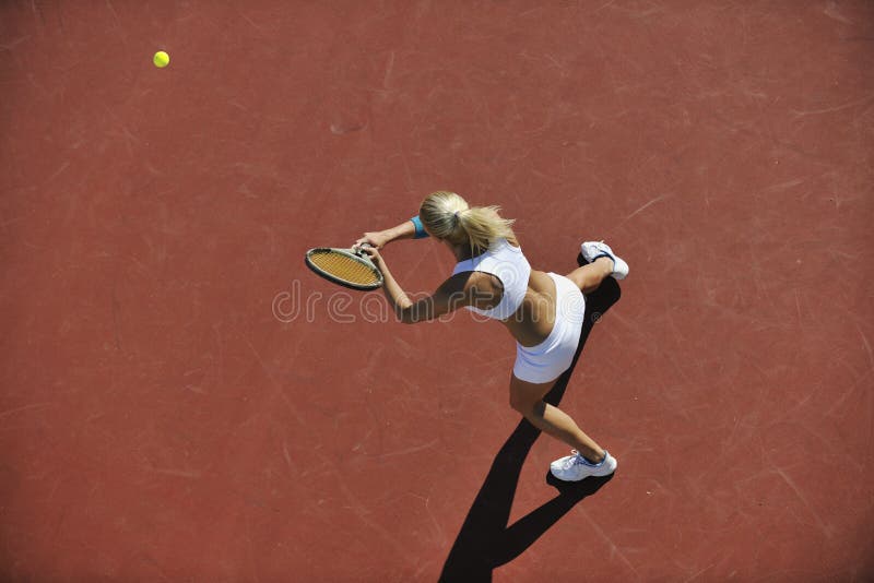 Young woman play tennis outdoor