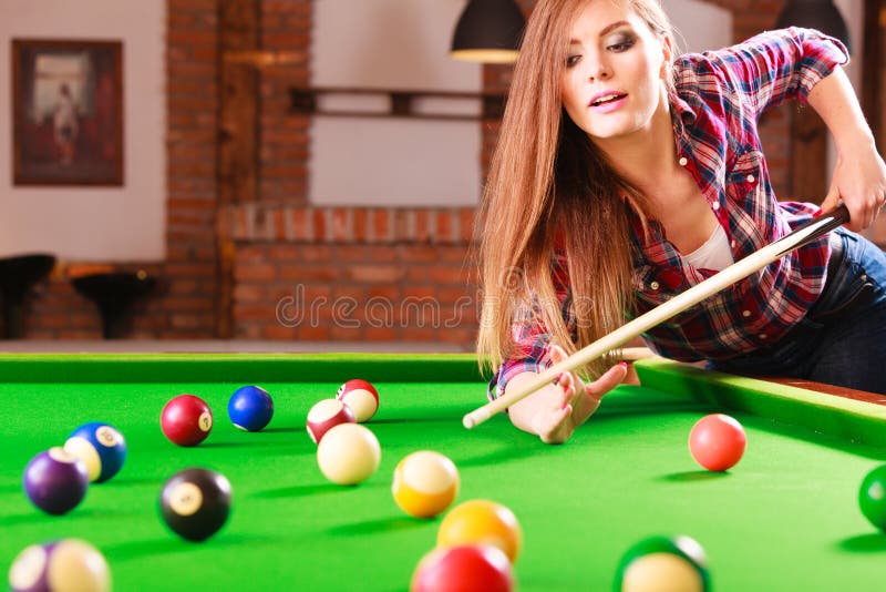 Premium Photo  Beautiful young girl came on a weekend to play billiards  for curiosity concept of a girl playing billiards