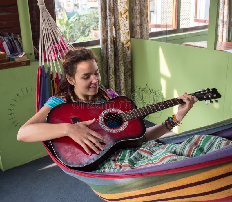 Young woman playing guitar stock photography Young woman playing guitar stock photography