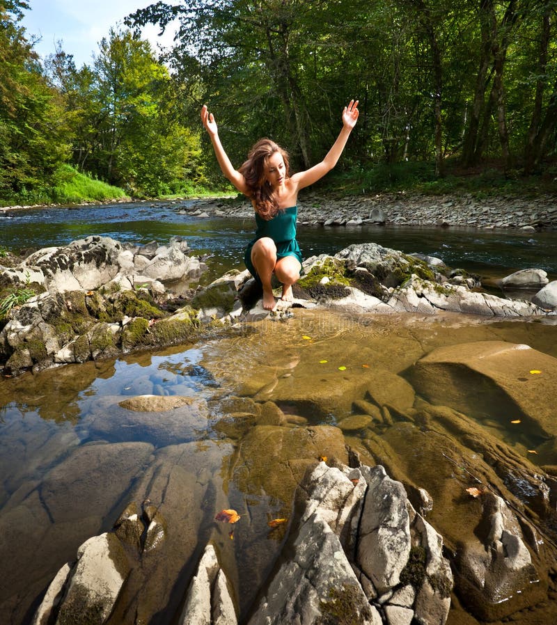 Young woman playing with water