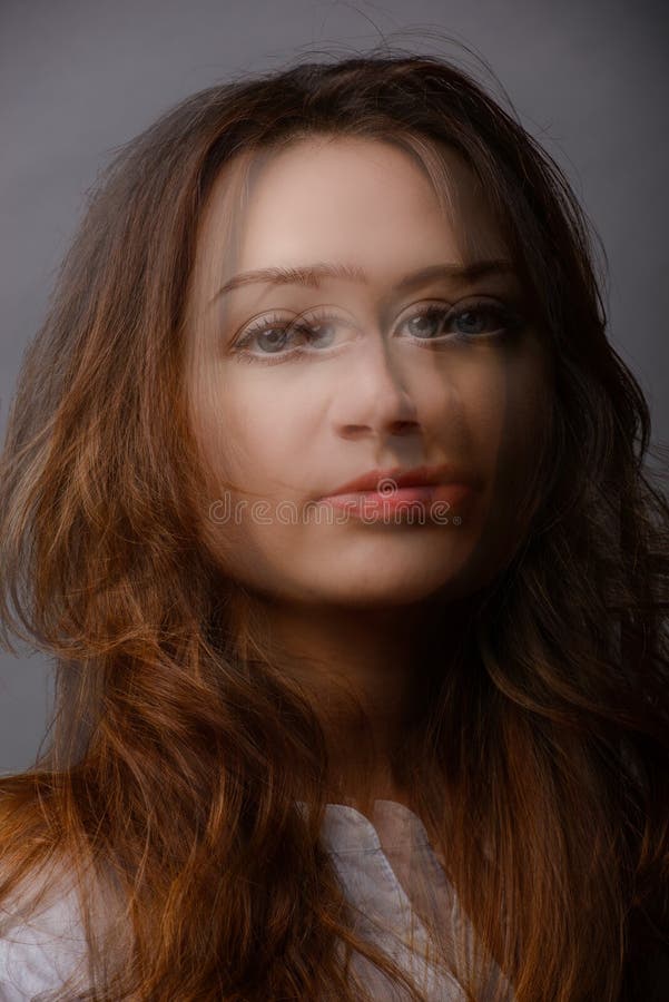 young woman portrait in studio, double exposure. split personality