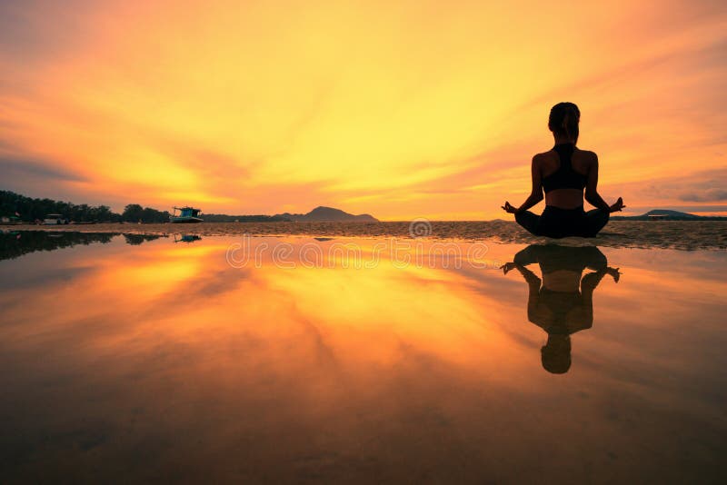 Silhouette young woman practicing yoga on the beach above sea at amazing  sunset. fitness, sport, yoga and healthy lifestyle concept. by Moon Soul.  Photo stock - StudioNow