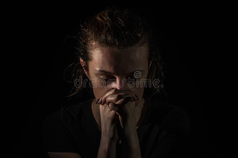 Young Woman Pray in the Dark on a Black Background Stock Image Image
