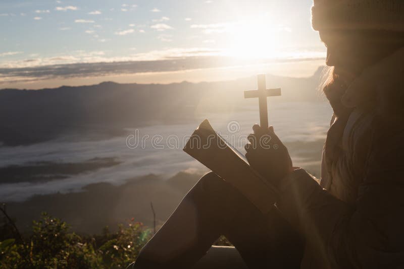 Young woman praying with hand, prayer concept for faith, spirituality and religion