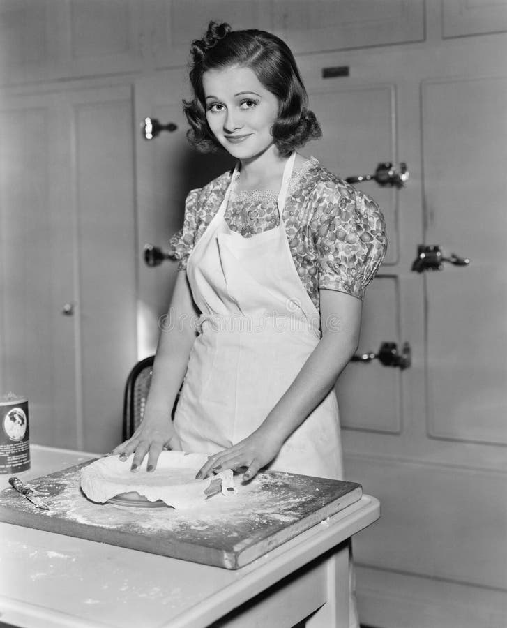 Young woman preparing food in the kitchen