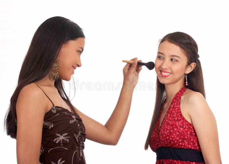 Young woman putting make up