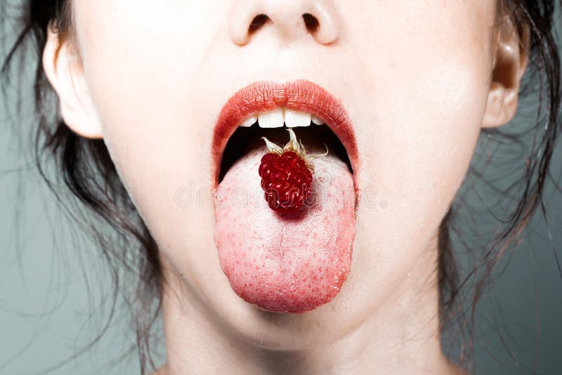 Lips with a raspberry stock photo. Image of beautiful 8724504
