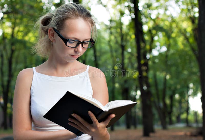 Young woman reading book