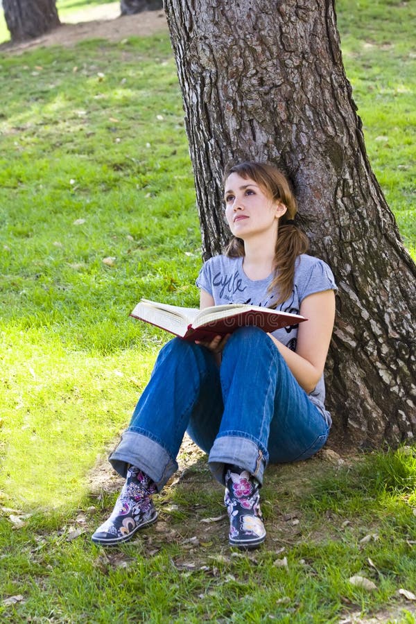 Young woman reading a book