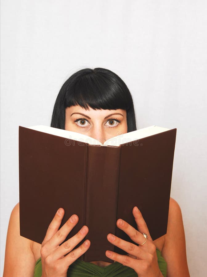 Young woman reading a book.