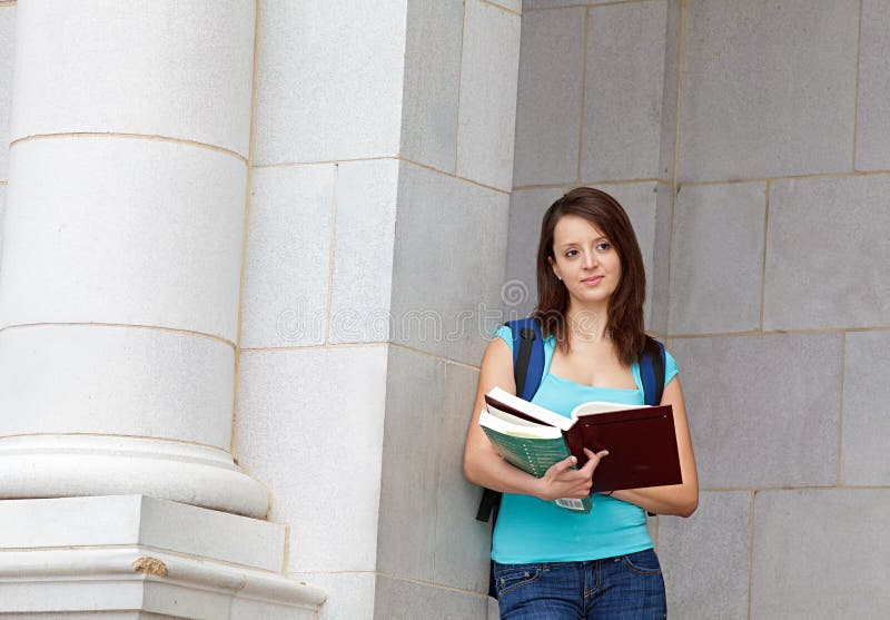 Young woman reading on campus