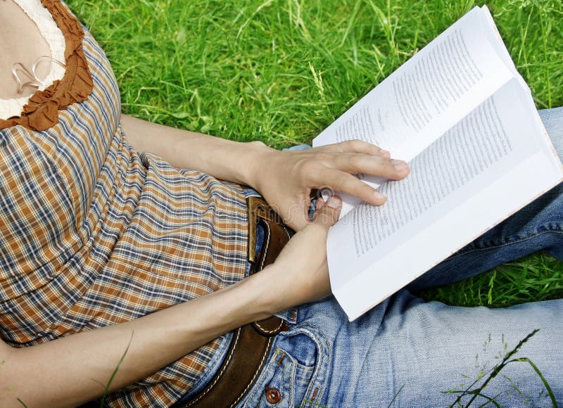 Young woman reading a novel