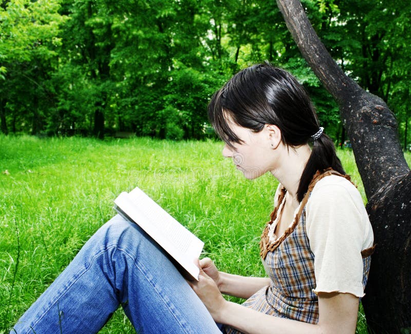 Young woman reading a novel