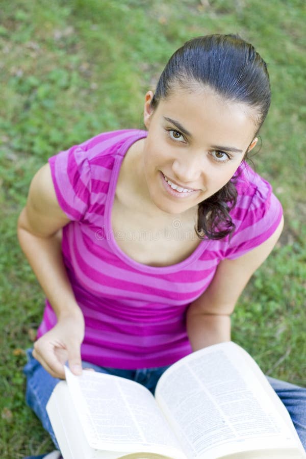 Young woman reading outdoor