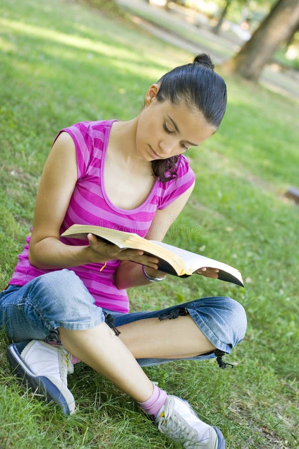 Young woman reading outdoor