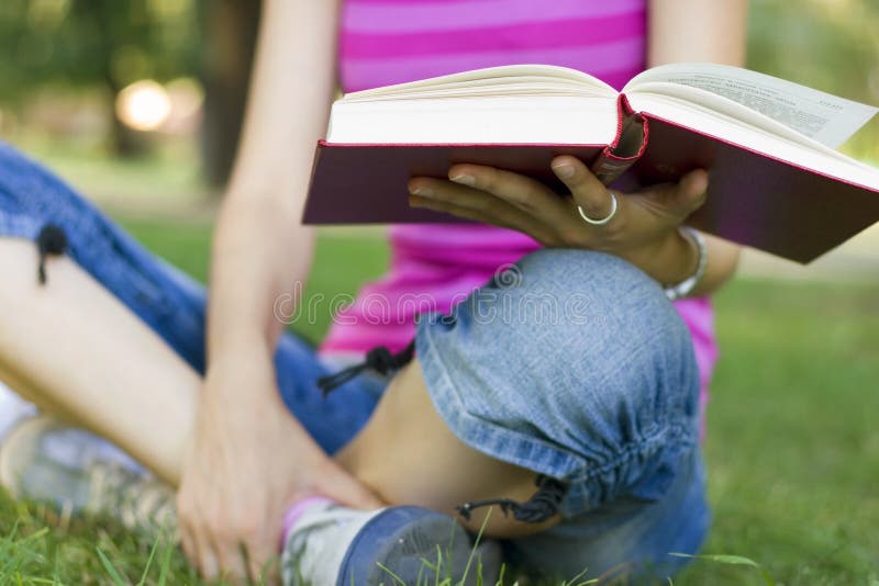 Young woman reading outdoor