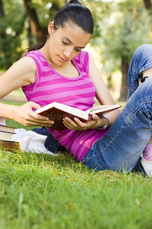 Young woman reading outdoor