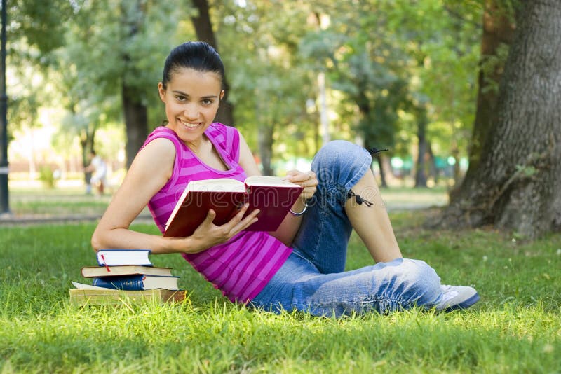 Young woman reading outdoor