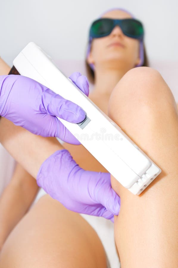 Young woman receiving epilation laser treatment