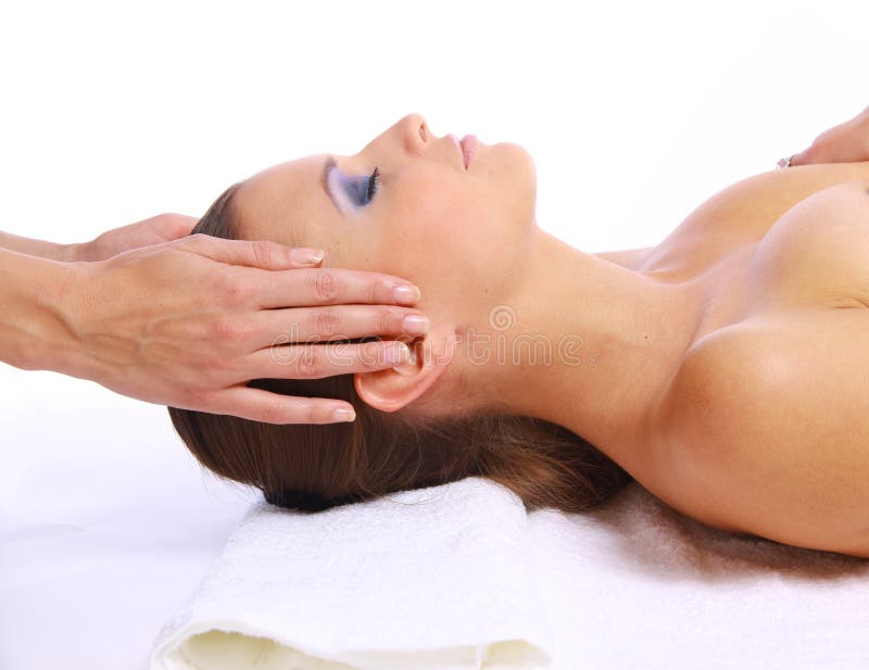 Young woman receiving facial massage