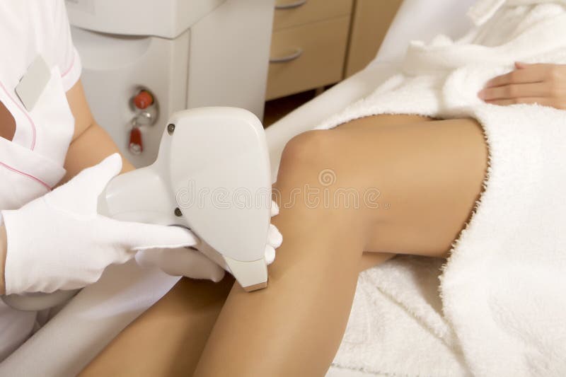 Young woman receiving laser therapy