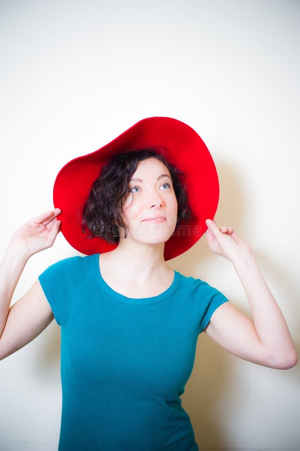 Young Woman with Red Hat and Blue Dress Posing Stock Image - Image of ...