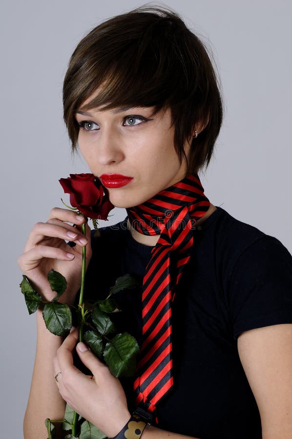 Young woman with red rose