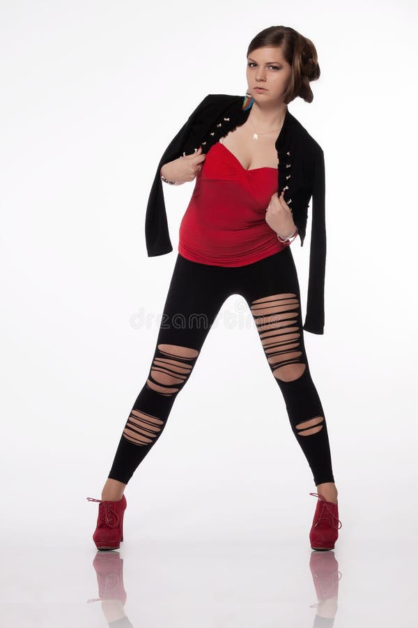 young woman red shirt modern jacket leggings holes re high heels exceptional hairstyle standing posing 40139569