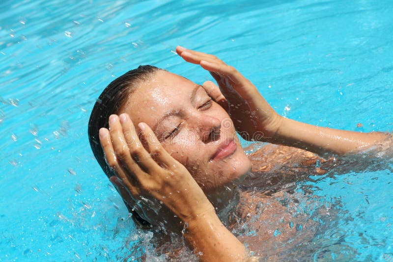 Young woman relax in the swimming pool