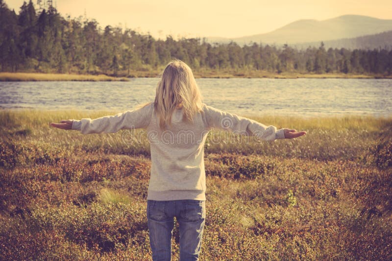 Young Woman relaxing outdoor hand raised Lifestyle