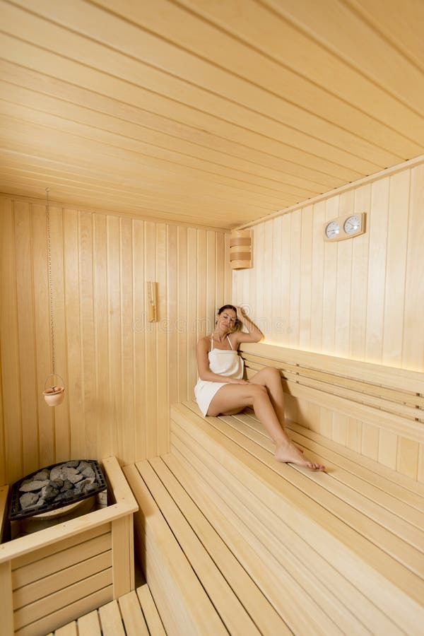 Young woman relaxing in the sauna stock image Young woman relaxing in the sauna stock image
