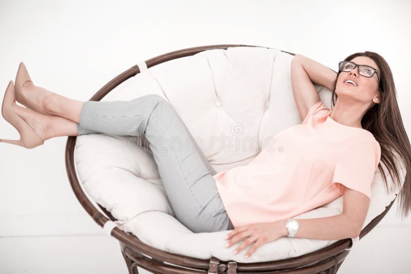 Young woman resting in a comfortable chair. stock photos Young woman resting in a comfortable chair. stock photos