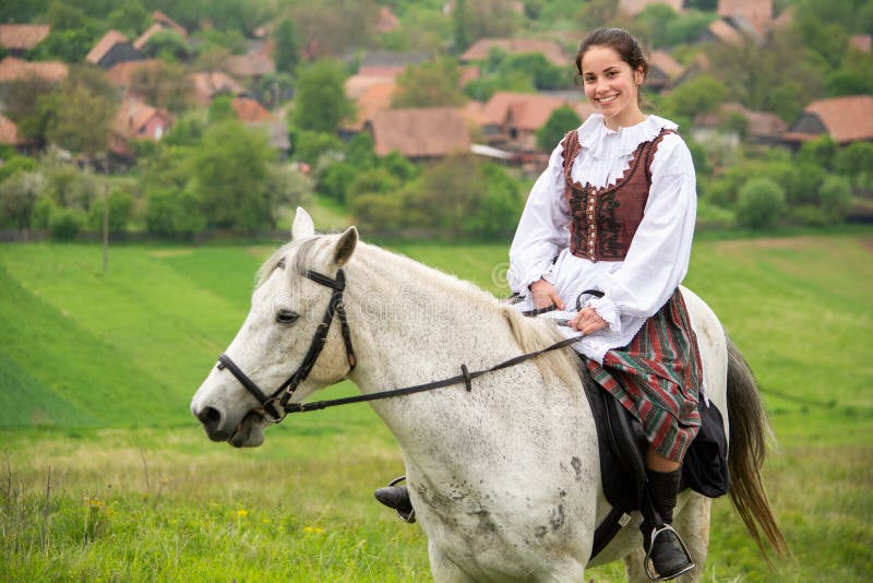 Young woman riding on beautiful horse , having fun in summer time , Romania countryside royalty free stock photography Young woman riding on beautiful horse , having fun in summer time , Romania countryside royalty free stock photography