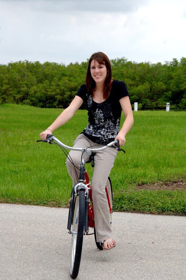 Young woman riding a bike