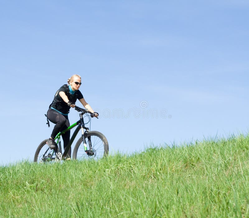 Young woman riding a mountain bike