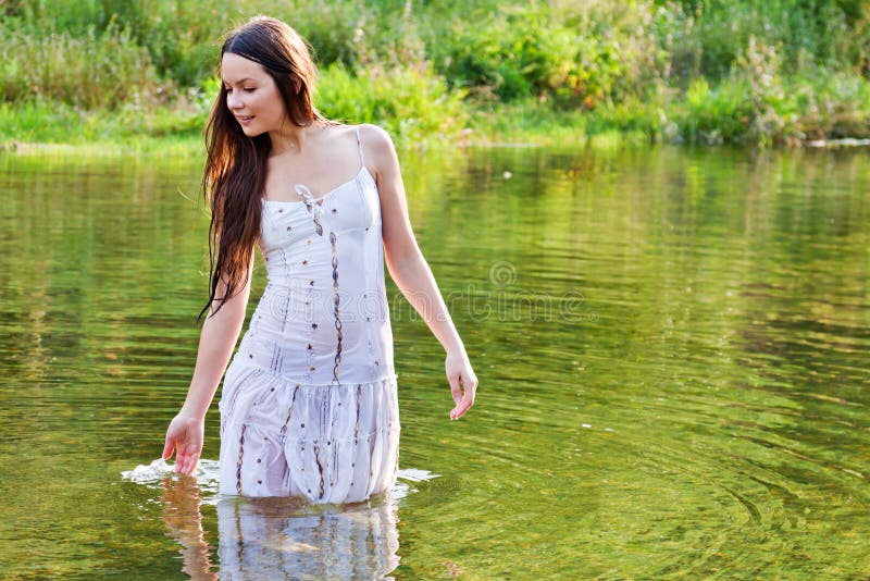 Young woman in a river