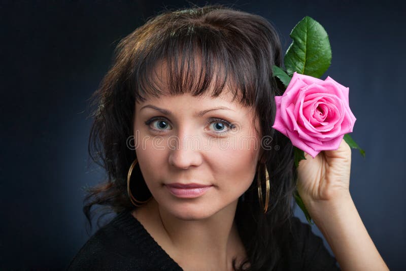 Young woman with rose